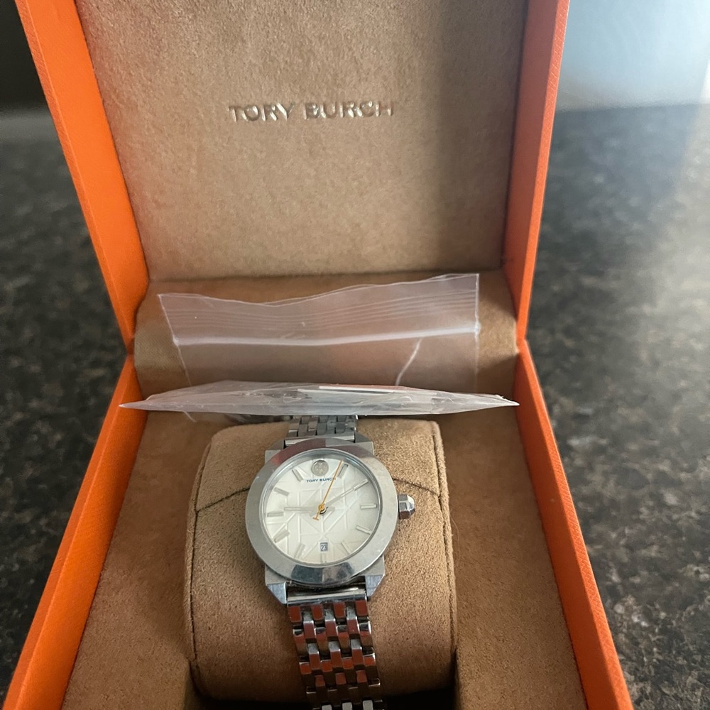 SOLD.  T  Burch watch with extra links.Needs a battery,works perfectly.